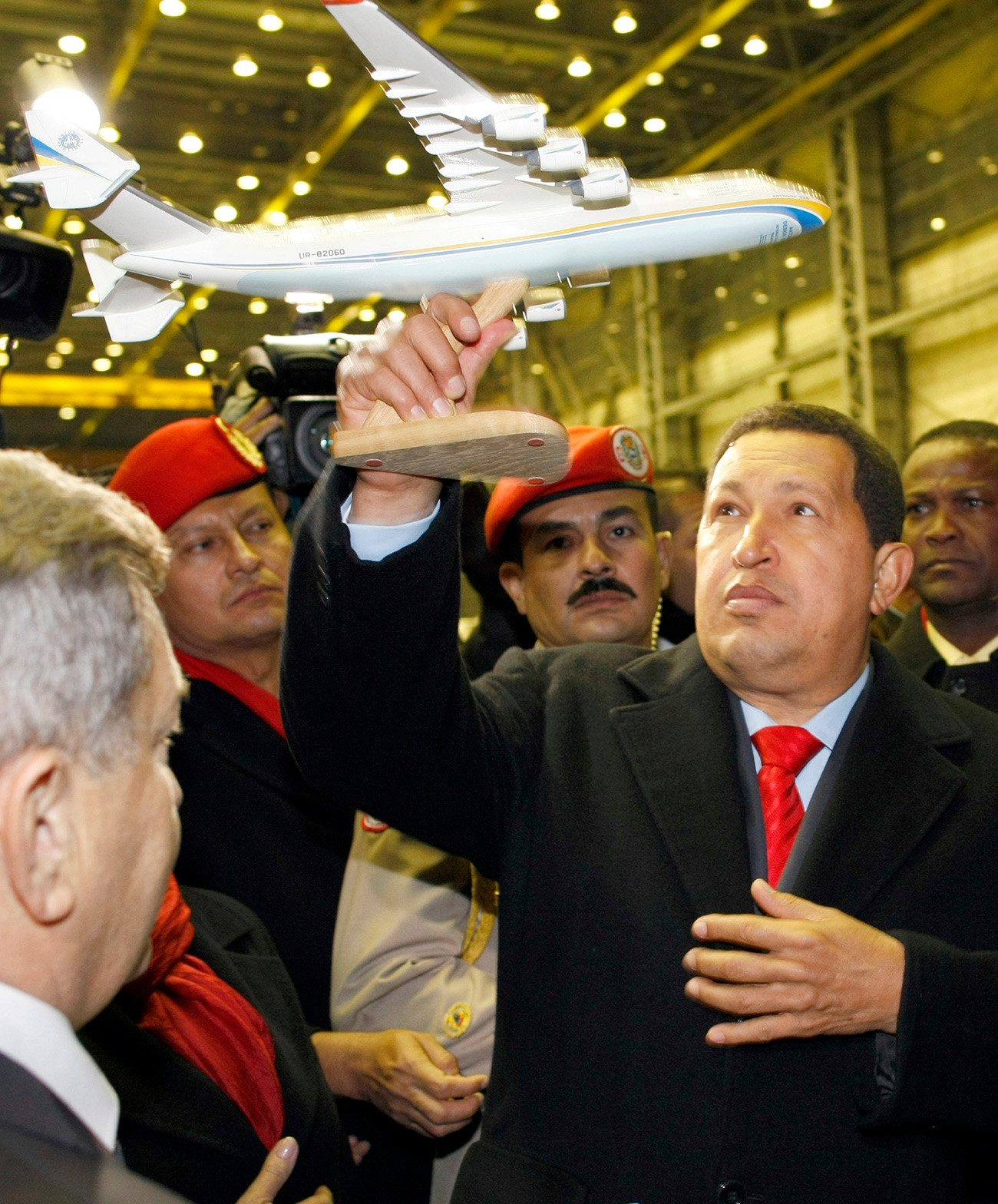 This photo taken on October 18, 2010 shows Venezuela President Hugo Chavez (R) holding up a model of the Antonov An-225 Mriya plane during his visit to the Antonov plant in Kiev.