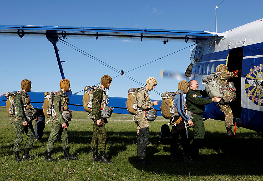Students of the General Yermolov Cadet School board an airplane for a parachute jump at an airdrome in the village of Novomaryevskaya outside the southern city of Stavropol, Russia, May 13, 2016
