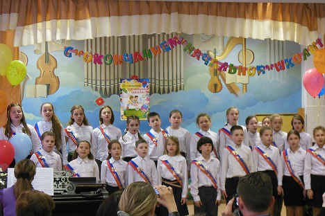 In the ceremony, children sing the last song in the elementary school. Source: Lara McCoy